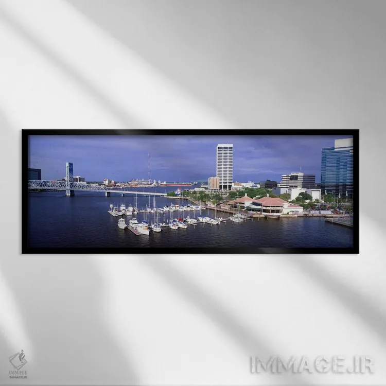 تابلو Florida, Jacksonville, St. Johns River, High angle view of Marina Riverwalk,آمریکا، فلوریدا، جکسونویل، رود سنت جانز، نمای بالا از مارینا ریورواک اثر پانورامیک ایمجز (استودیو عکاسی عریض) - نمای قابدار مشکی