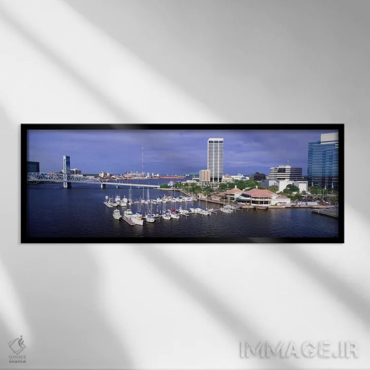 تابلو Florida, Jacksonville, St. Johns River, High angle view of Marina Riverwalk,آمریکا، فلوریدا، جکسونویل، رود سنت جانز، نمای بالا از مارینا ریورواک اثر پانورامیک ایمجز (استودیو عکاسی عریض) - نمای قابدار مشکی