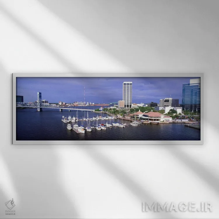 تابلو Florida, Jacksonville, St. Johns River, High angle view of Marina Riverwalk,آمریکا، فلوریدا، جکسونویل، رود سنت جانز، نمای بالا از مارینا ریورواک اثر پانورامیک ایمجز (استودیو عکاسی عریض) - نمای قابدار سفید