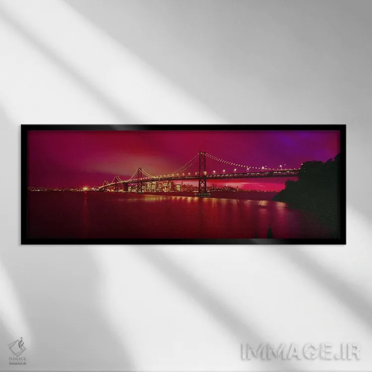 تابلو San Francisco, California, USA,پل معلق روشن در شب (پل بیبریج)، سانفرانسیسکو، کالیفرنیا، آمریکا اثر پانورامیک ایمجز (استودیو عکاسی عریض) - نمای قابدار مشکی