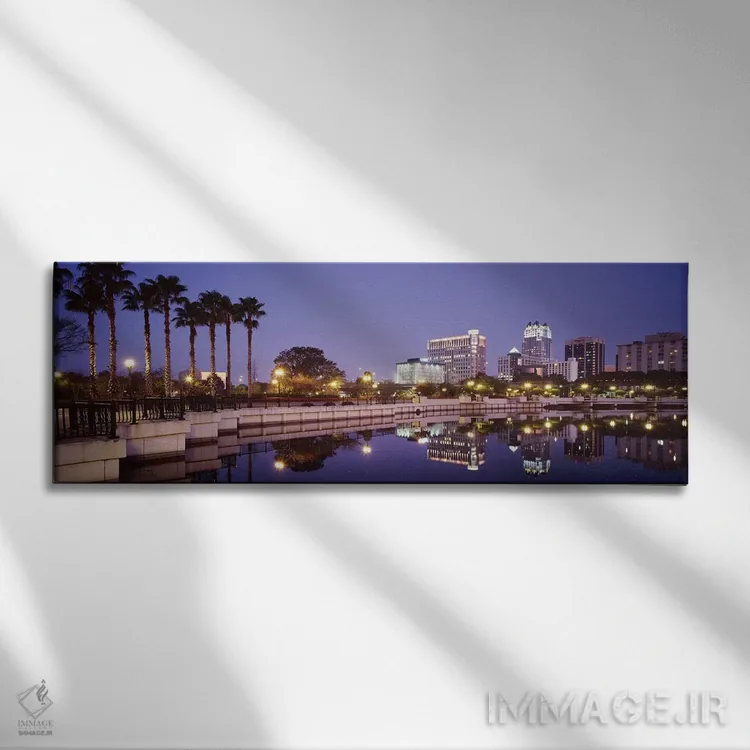 تابلو Lake Luceme, Orlando, Florida, USA,انعکاس ساختمانها در دریاچه، دریاچه لوکیم، اورلاندو، فلوریدا، آمریکا اثر پانورامیک ایمجز (استودیو عکاسی عریض) - نمای روبهرو روی دیوار