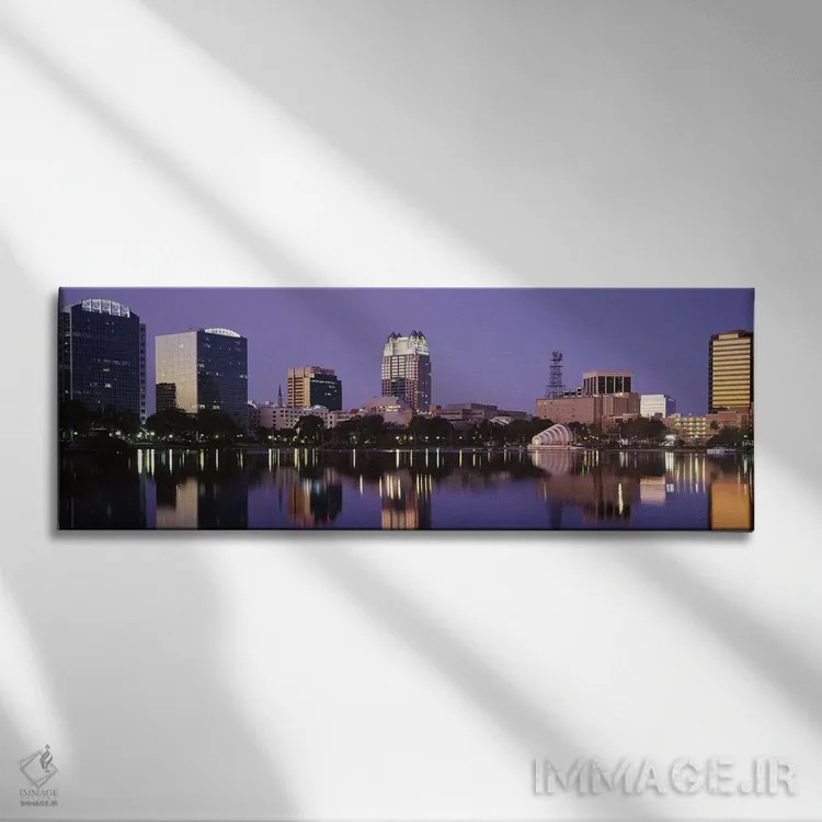 تابلو Lake Eola, Orlando, Florida, USA,ساختمانهای اداری کنار دریاچه، دریاچه ایولا، اورلاندو، فلوریدا، آمریکا اثر پانورامیک ایمجز (استودیو عکاسی عریض) - نمای روبهرو روی دیوار
