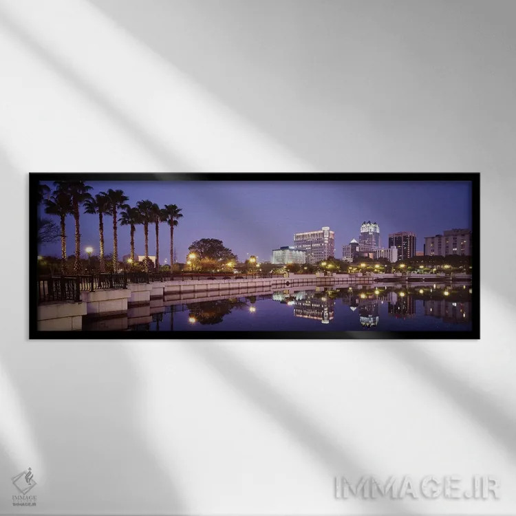 تابلو Lake Luceme, Orlando, Florida, USA,انعکاس ساختمانها در دریاچه، دریاچه لوکیم، اورلاندو، فلوریدا، آمریکا اثر پانورامیک ایمجز (استودیو عکاسی عریض) - نمای قابدار مشکی