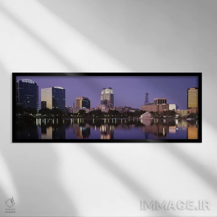 تابلو Lake Eola, Orlando, Florida, USA,ساختمانهای اداری کنار دریاچه، دریاچه ایولا، اورلاندو، فلوریدا، آمریکا اثر پانورامیک ایمجز (استودیو عکاسی عریض) - نمای قابدار مشکی