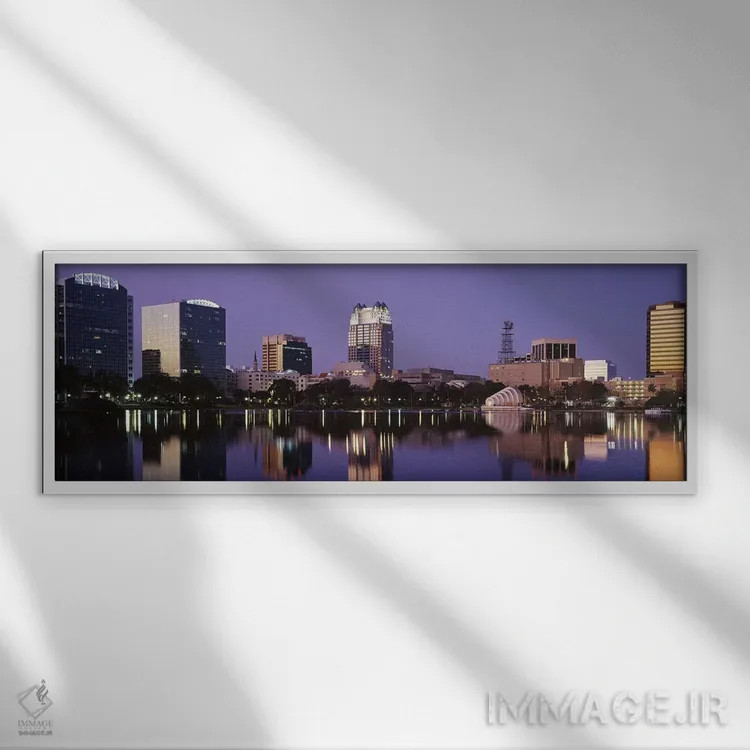 تابلو Lake Eola, Orlando, Florida, USA,ساختمانهای اداری کنار دریاچه، دریاچه ایولا، اورلاندو، فلوریدا، آمریکا اثر پانورامیک ایمجز (استودیو عکاسی عریض) - نمای قابدار سفید