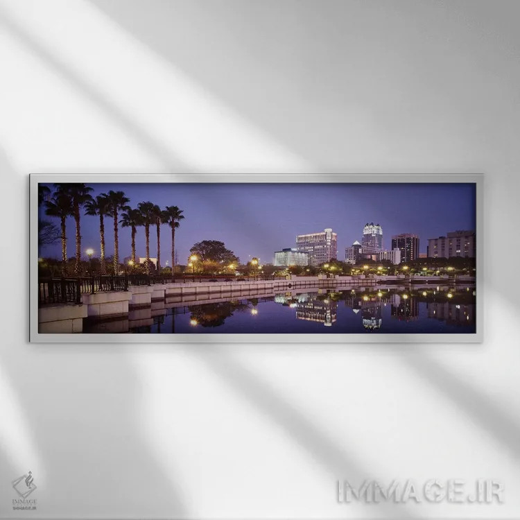 تابلو Lake Luceme, Orlando, Florida, USA,انعکاس ساختمانها در دریاچه، دریاچه لوکیم، اورلاندو، فلوریدا، آمریکا اثر پانورامیک ایمجز (استودیو عکاسی عریض) - نمای قابدار سفید