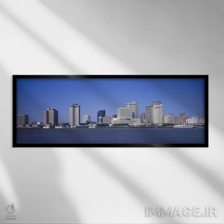تابلو Mississippi River, New Orleans, Louisiana, USA,ساختمانها در کنار آب، رودخانه میسیسیپی، نیواورلئان، لوئیزیانا، آمریکا اثر پانورامیک ایمجز (استودیو عکاسی عریض) - نمای قابدار مشکی