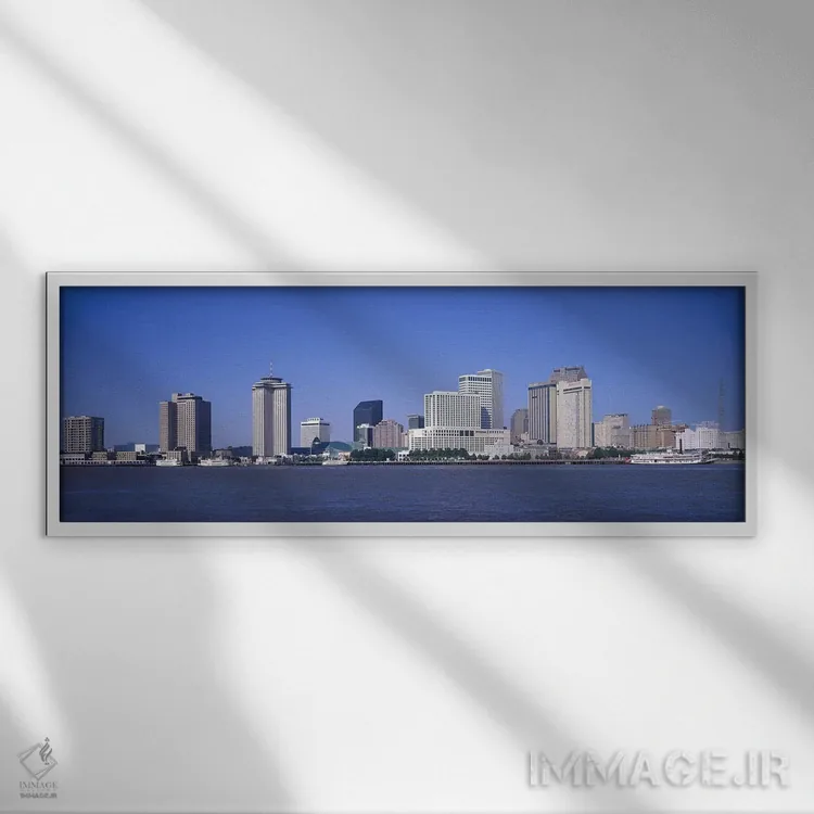 تابلو Mississippi River, New Orleans, Louisiana, USA,ساختمانها در کنار آب، رودخانه میسیسیپی، نیواورلئان، لوئیزیانا، آمریکا اثر پانورامیک ایمجز (استودیو عکاسی عریض) - نمای قابدار سفید