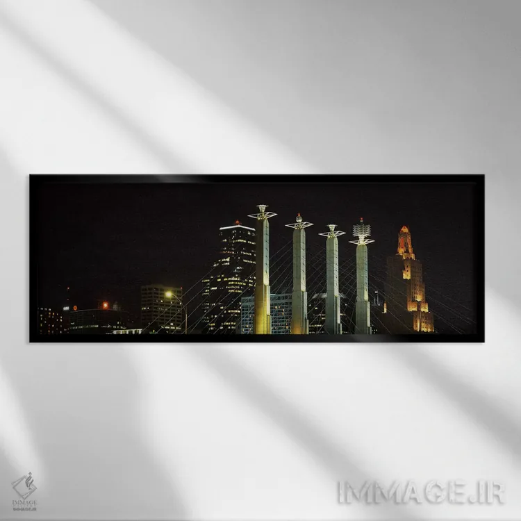 تابلو Kansas City, Jackson County, Missouri, USA,ساختمانهای روشن در شب در شهری، سالن بارتل، کانزاس سیتی، شهرستان جکسون، میزوری، آمریکا اثر پانورامیک ایمجز (استودیو عکاسی عریض) - نمای قابدار مشکی