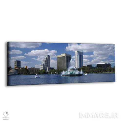 تابلو Lake Eola, Orlando, Florida, USA,ساختمانهای کنار آب، دریاچه ایولا، اورلاندو، فلوریدا، ایالات متحده آمریکا اثر پانورامیک ایمجز (استودیو عکاسی عریض) - نمای پرسپکتیو محصول