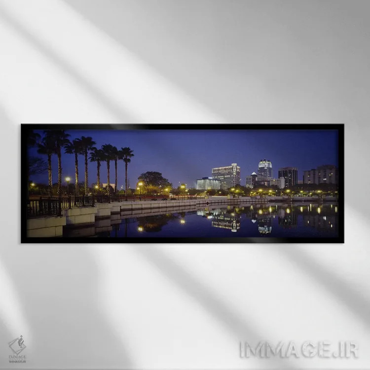 تابلو Orlando, Florida, USA,انعکاس ساختمانها در آب، اورلاندو، فلوریدا، ایالات متحده آمریکا اثر پانورامیک ایمجز (استودیو عکاسی عریض) - نمای قابدار مشکی