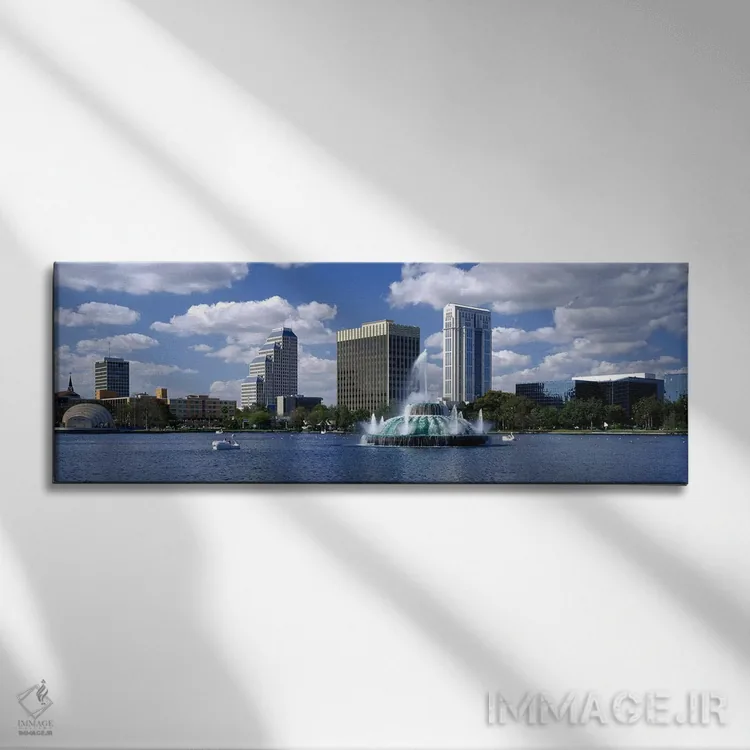 تابلو Lake Eola, Orlando, Florida, USA,ساختمانهای کنار آب، دریاچه ایولا، اورلاندو، فلوریدا، ایالات متحده آمریکا اثر پانورامیک ایمجز (استودیو عکاسی عریض) - نمای روبهرو روی دیوار