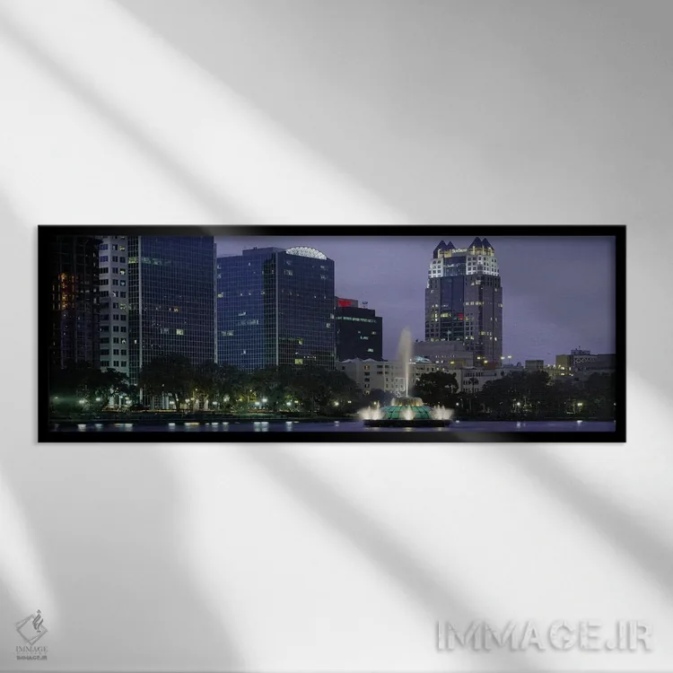 تابلو Lake Eola, Summerlin Park, Orlando, Orange County, Florida, USA #2,فواره دریاچهای روشن در شب، دریاچه ایولا، پارک سامرلین، اورلاندو، شهرستان اورنج، فلوریدا، ایالات متحده آمریکا (۲) اثر پانورامیک ایمجز (استودیو عکاسی عریض) - نمای قابدار مشکی