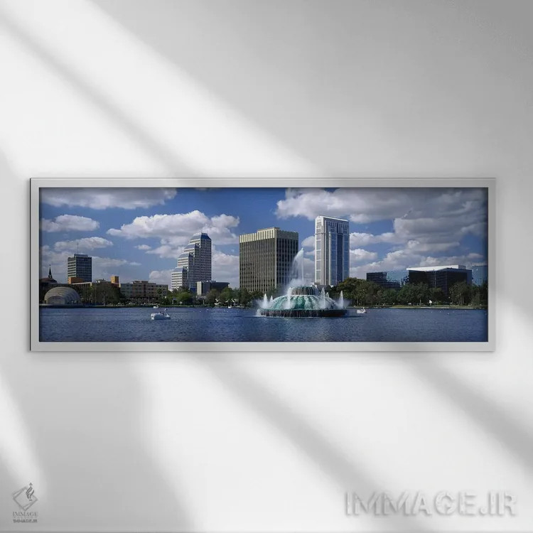 تابلو Lake Eola, Orlando, Florida, USA,ساختمانهای کنار آب، دریاچه ایولا، اورلاندو، فلوریدا، ایالات متحده آمریکا اثر پانورامیک ایمجز (استودیو عکاسی عریض) - نمای قابدار سفید
