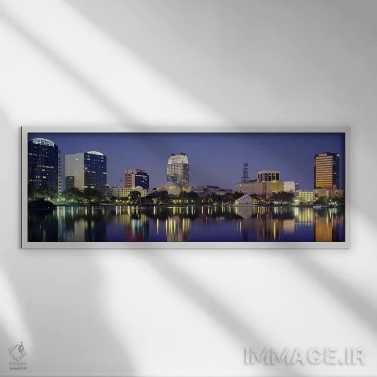 تابلو Orlando, Florida, USA #2,انعکاس ساختمانها در آب، اورلاندو، فلوریدا، ایالات متحده آمریکا (۲) اثر پانورامیک ایمجز (استودیو عکاسی عریض) - نمای قابدار سفید