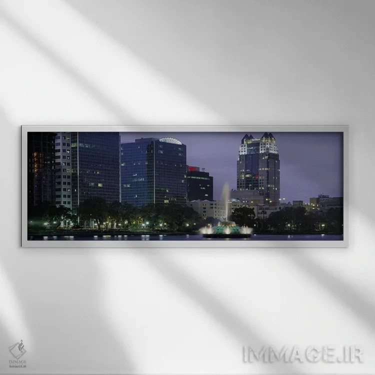 تابلو Lake Eola, Summerlin Park, Orlando, Orange County, Florida, USA #2,فواره دریاچهای روشن در شب، دریاچه ایولا، پارک سامرلین، اورلاندو، شهرستان اورنج، فلوریدا، ایالات متحده آمریکا (۲) اثر پانورامیک ایمجز (استودیو عکاسی عریض) - نمای قابدار سفید