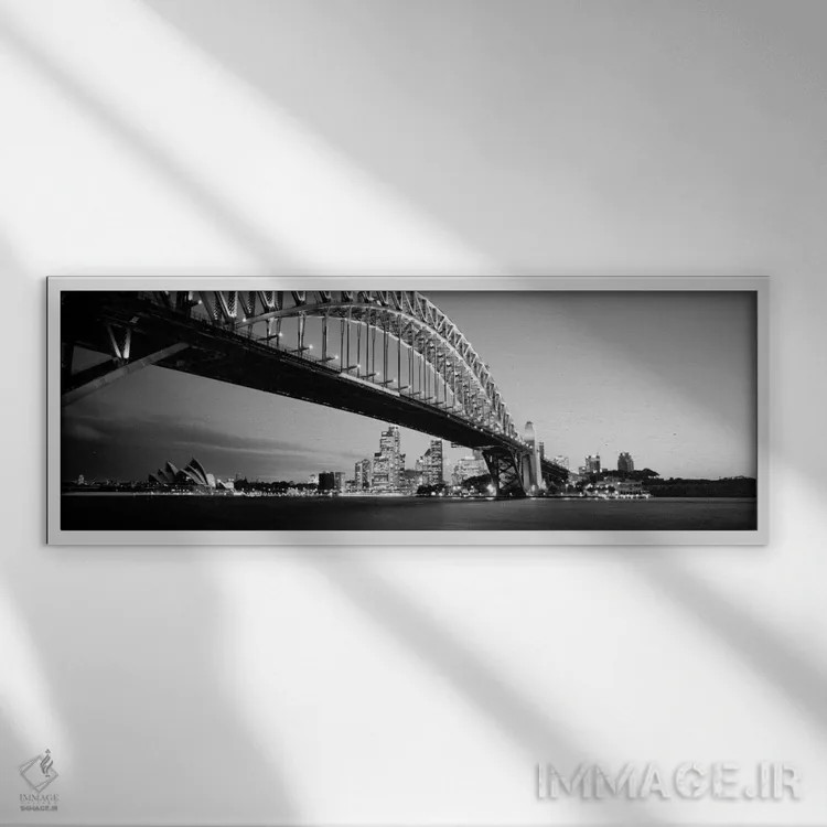 تابلو Sydney Harbor Bridge, Sydney, New South Wales, Australia (black & white),نمای زاویه پایین از یک پل، پل بندر سیدنی، سیدنی، نیو ساوت ولز، استرالیا (سیاه و سفید) اثر پانورامیک ایمجز (استودیو عکاسی عریض) - نمای قابدار سفید