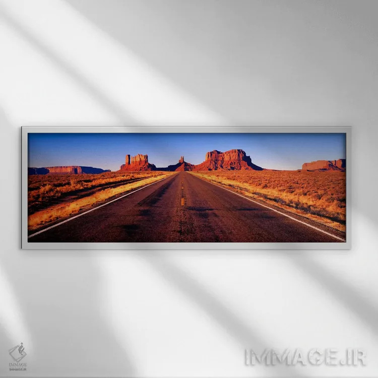تابلو Monument Valley, Navajo Nation, Arizona, USA,نمایی از بزرگراه ۱۶۳ آمریکا، درهٔ یادمان، ملت ناواهو، آریزونا، ایالات متحده آمریکا اثر پانورامیک ایمجز (استودیو عکاسی عریض) - نمای قابدار سفید