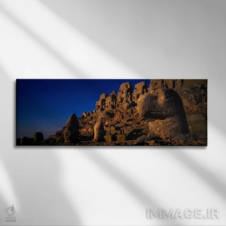 تابلو Mount Nemrut, Nemrud Dagh, Cappadocia, Antolia, Turkey,سنگها روی صخره، کوه نمرود، نمرود داغ، کاپادوکیا، آناتولی، ترکیه اثر پانورامیک ایمجز (استودیو عکاسی عریض) - نمای روبهرو روی دیوار
