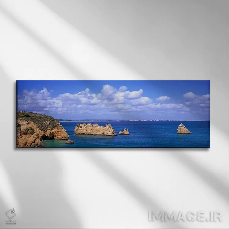 تابلو Dona Ana Beach, Lagos, Algarve Region, Portugal,چشمانداز دریایی ابری با صخرههای آهکی، ساحل دونا آنا، لاگوس، منطقه آلگاروه، پرتغال اثر پانورامیک ایمجز (استودیو عکاسی عریض) - نمای روبهرو روی دیوار