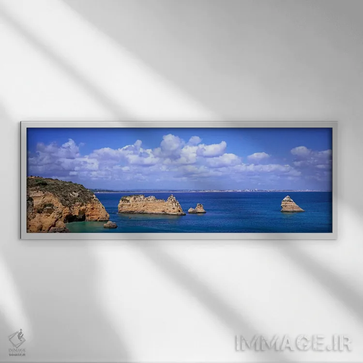 تابلو Dona Ana Beach, Lagos, Algarve Region, Portugal,چشمانداز دریایی ابری با صخرههای آهکی، ساحل دونا آنا، لاگوس، منطقه آلگاروه، پرتغال اثر پانورامیک ایمجز (استودیو عکاسی عریض) - نمای قابدار سفید