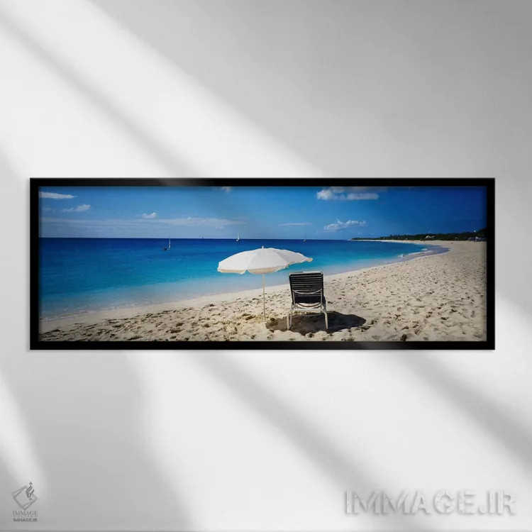 تابلو Saint Martin, French West Indies,یک صندلی ساحلی و چتر تکی روی شن، سنت مارتین، هند غربی فرانسه اثر پانورامیک ایمجز (استودیو عکاسی عریض) - نمای قابدار مشکی