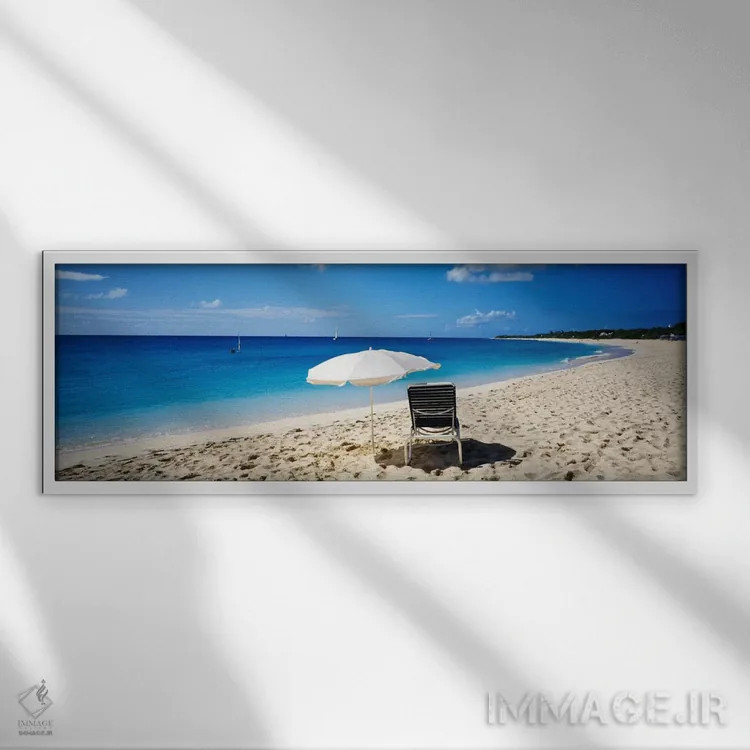 تابلو Saint Martin, French West Indies,یک صندلی ساحلی و چتر تکی روی شن، سنت مارتین، هند غربی فرانسه اثر پانورامیک ایمجز (استودیو عکاسی عریض) - نمای قابدار سفید