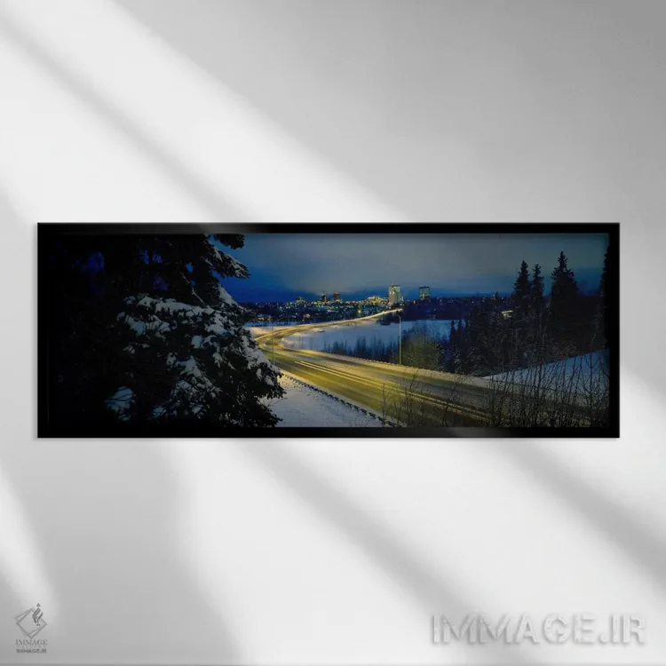تابلو Anchorage, Alaska, USA,جاده پیچ در پیچ میان مناظر پوشیده از برف، انکوریج، آلاسکا، ایالات متحده آمریکا اثر پانورامیک ایمجز (استودیو عکاسی عریض) - نمای قابدار مشکی