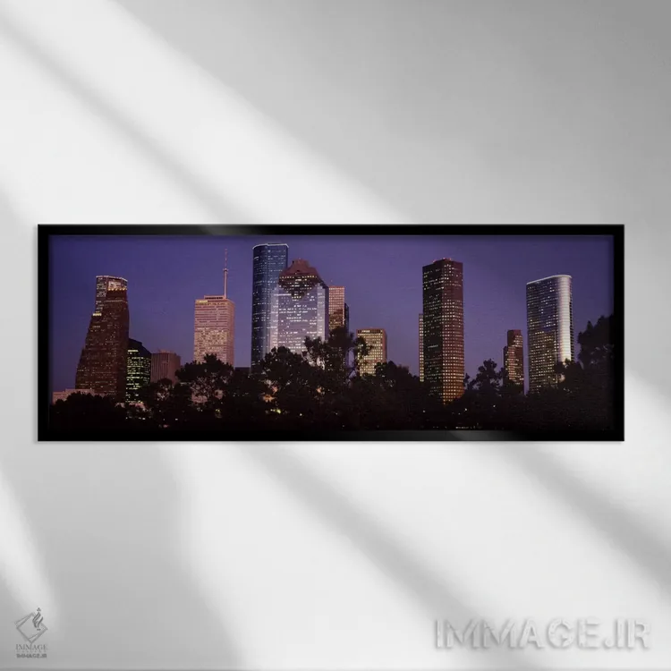 تابلو Harris county, Texas, USA,ساختمانهای روشنشده در شهر هنگام غروب، هیوستون، شهرستان هریس، تگزاس، آمریکا اثر پانورامیک ایمجز (استودیو عکاسی عریض) - نمای قابدار مشکی
