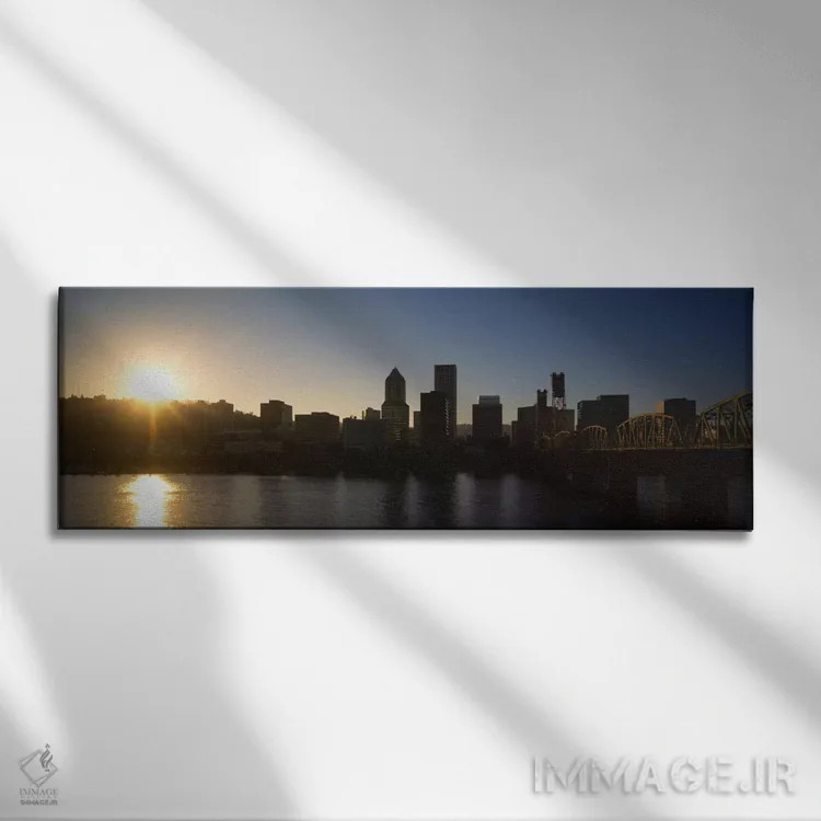 تابلو Willamette River, Portland, Oregon, USA,ساختمانهای کنار آب هنگام غروب، رودخانه ویلامت، پورتلند، اورگان، ایالات متحده آمریکا اثر پانورامیک ایمجز (استودیو عکاسی عریض) - نمای روبهرو روی دیوار