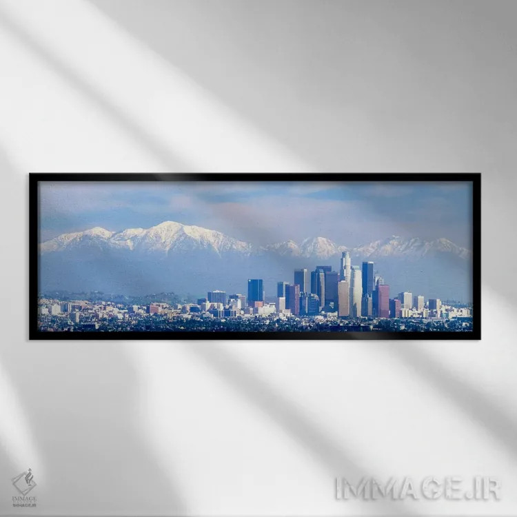 تابلو San Gabriel Mountains, City of Los Angeles, California, USA,ساختمانها در شهری با کوههای پوشیده از برف در پسزمینه، کوههای سن گابریل، لسآنجلس، کالیفرنیا، ایالات متحده آمریکا اثر پانورامیک ایمجز (استودیو عکاسی عریض) - نمای قابدار مشکی