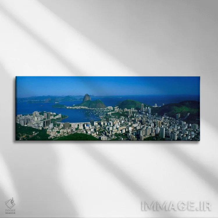 تابلو Rio de Janeiro, Brazil,نمای هوایی از محلههای بوتافوگو و اورکا با کوه کلهقندی، ریو دو ژانیرو، برزیل اثر پانورامیک ایمجز (استودیو عکاسی عریض) - نمای روبهرو روی دیوار