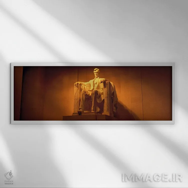 تابلو Washington DC, Lincoln Memorial, Low angle view of the statue of Abraham Lincoln,آمریکا، واشینگتن دیسی، یادبود لینکلن، نمای زاویه پایین از تندیس آبراهام لینکلن اثر پانورامیک ایمجز (استودیو عکاسی عریض) - نمای قابدار سفید