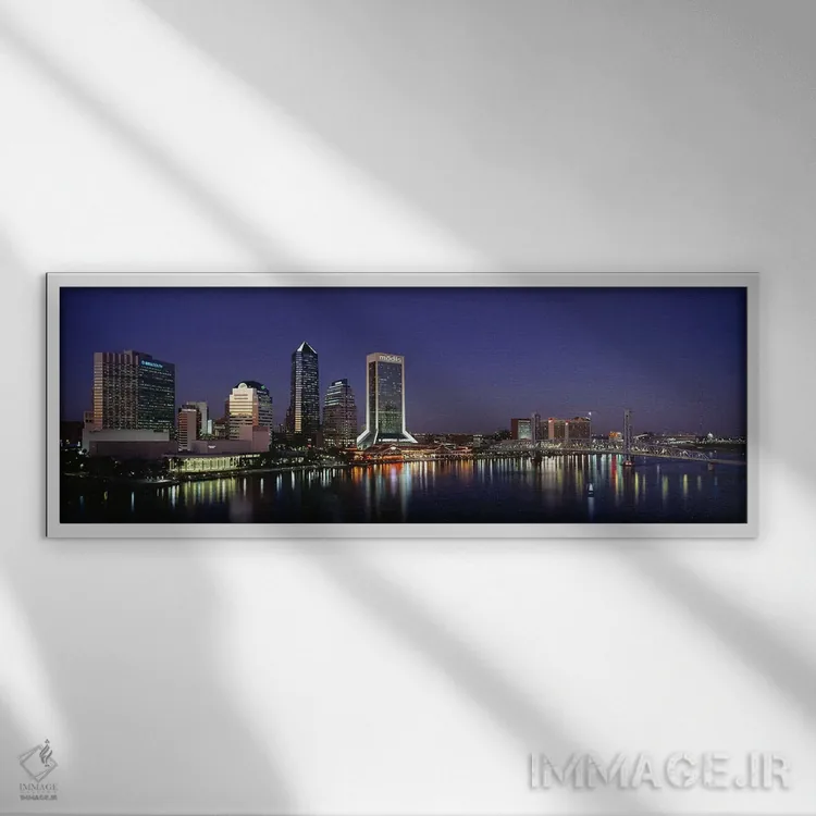 تابلو Jacksonville, Florida, USA,ساختمانهای روشنشده در شب، جکسونویل، فلوریدا، آمریکا اثر پانورامیک ایمجز (استودیو عکاسی عریض) - نمای قابدار سفید