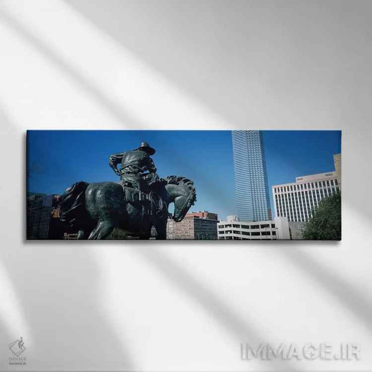 تابلو Dallas, Texas, USA,نما از زاویه پایین از یک مجسمه در مقابل ساختمانها، دالاس، تگزاس، آمریکا اثر پانورامیک ایمجز (استودیو عکاسی عریض) - نمای روبهرو روی دیوار