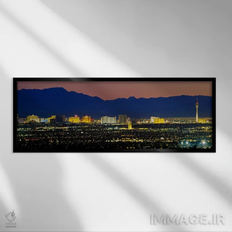 تابلو Las Vegas, Nevada, USA,نمای هوایی از ساختمانهای روشنشده در غروب، لاس وگاس، نوادا، آمریکا اثر پانورامیک ایمجز (استودیو عکاسی عریض) - نمای قابدار مشکی