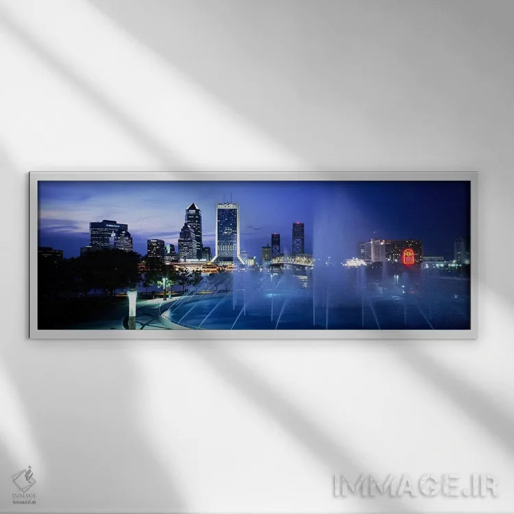تابلو Cityscape, Night, Jacksonville, Florida, USA,فواره، منظره شهری، شب، جکسونویل، فلوریدا، آمریکا اثر پانورامیک ایمجز (استودیو عکاسی عریض) - نمای قابدار سفید