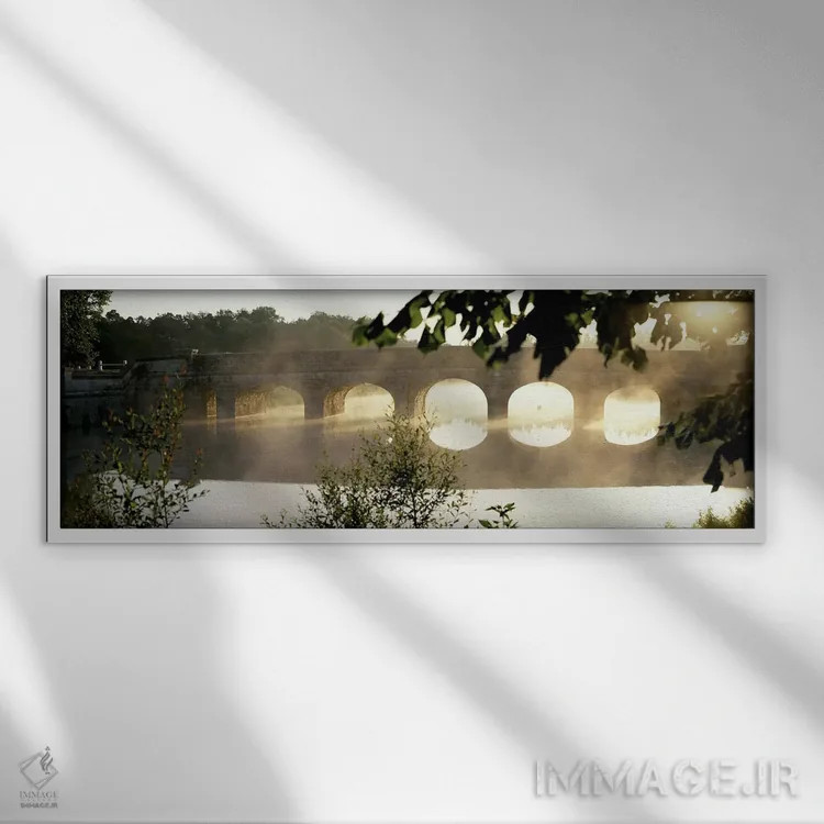 تابلو Loire Valley, France,مه صبحگاهی پیرامون پلی سنگی روی رود کُسون، دره لوآر، فرانسه اثر پانورامیک ایمجز (استودیو عکاسی عریض) - نمای قابدار سفید