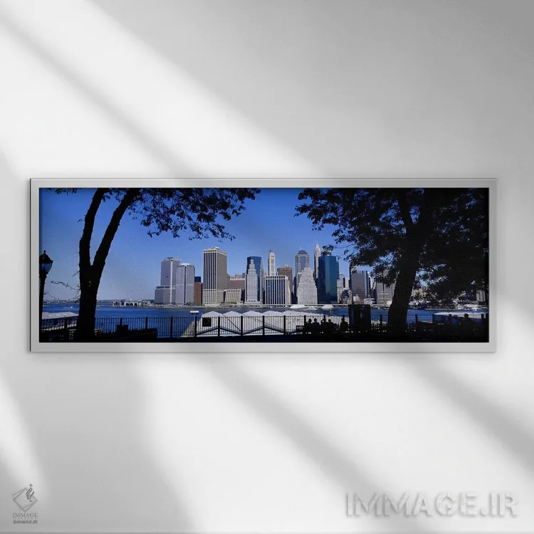 تابلو Manhattan, New York City, New York State, USA,آسمانخراشها کنار آب، منهتن، نیویورک، ایالت نیویورک، آمریکا اثر پانورامیک ایمجز (استودیو عکاسی عریض) - نمای قابدار سفید