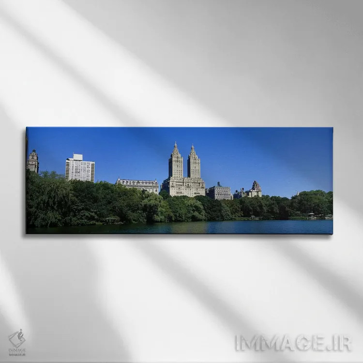 تابلو New York City, New York State, USA,ساختمانها در کناره یک دریاچه در منهتن، شهر نیویورک، ایالات متحده اثر پانورامیک ایمجز (استودیو عکاسی عریض) - نمای روبهرو روی دیوار