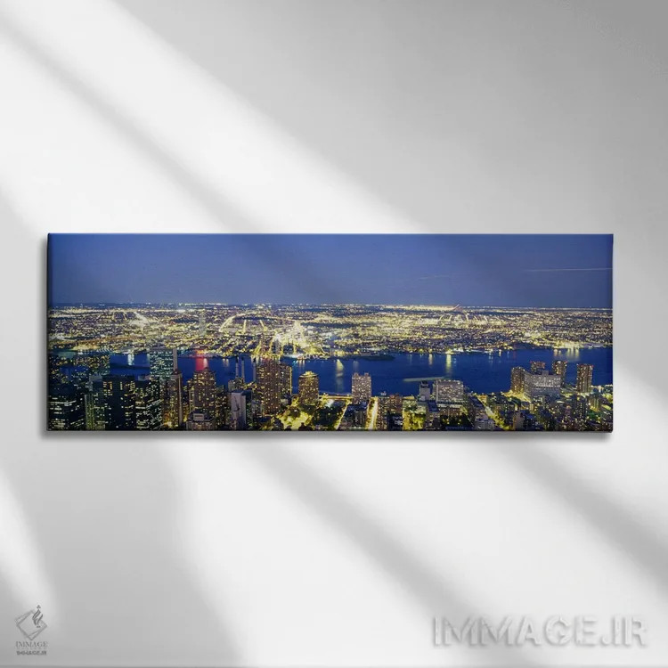 تابلو NYC, New York City, New York State, USA,نمای هوایی ساختمانهای روشن در غروب، منهتن، نیویورک، ایالات متحده اثر پانورامیک ایمجز (استودیو عکاسی عریض) - نمای روبهرو روی دیوار