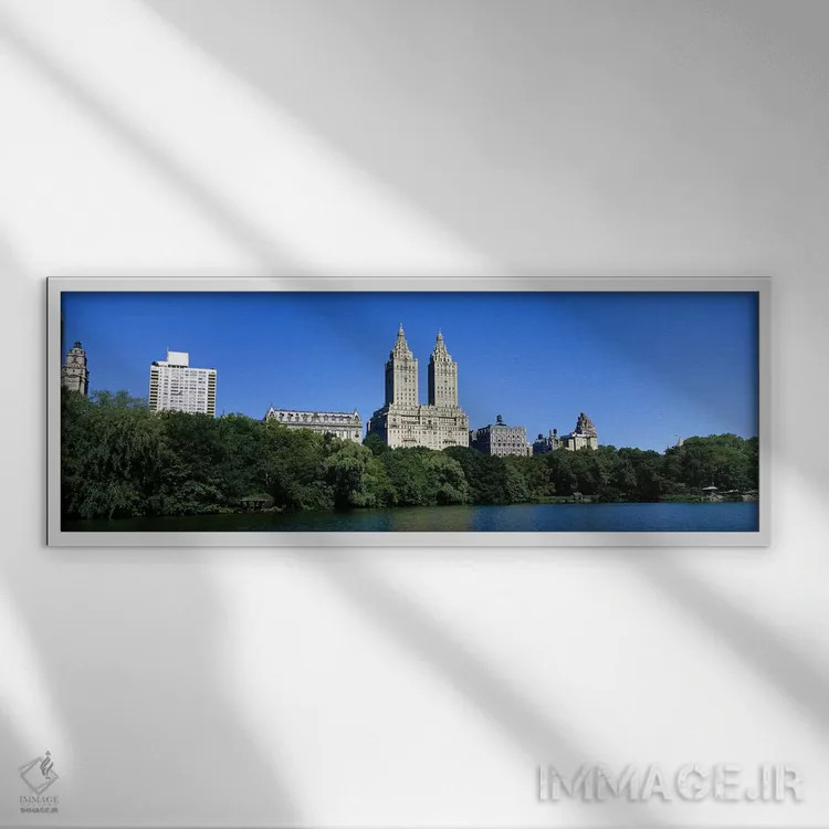 تابلو New York City, New York State, USA,ساختمانها در کناره یک دریاچه در منهتن، شهر نیویورک، ایالات متحده اثر پانورامیک ایمجز (استودیو عکاسی عریض) - نمای قابدار سفید