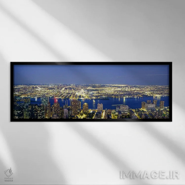 تابلو NYC, New York City, New York State, USA,نمای هوایی ساختمانهای روشن در غروب، منهتن، نیویورک، ایالات متحده اثر پانورامیک ایمجز (استودیو عکاسی عریض) - نمای قابدار مشکی