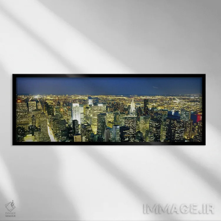 تابلو NYC, New York City, New York State, USA,نمای هوایی ساختمانهای روشن در غروب، منهتن، نیویورک، ایالات متحده اثر پانورامیک ایمجز (استودیو عکاسی عریض) - نمای قابدار مشکی