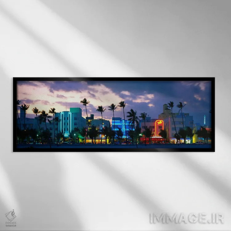 تابلو Ocean Drive, Miami Beach, Florida, USA,ساختمانهای روشن در غروب، اوشن درایو، میامی بیچ، فلوریدا، ایالات متحده اثر پانورامیک ایمجز (استودیو عکاسی عریض) - نمای قابدار مشکی