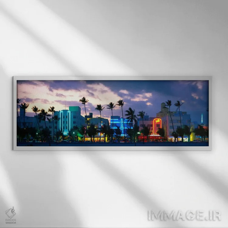 تابلو Ocean Drive, Miami Beach, Florida, USA,ساختمانهای روشن در غروب، اوشن درایو، میامی بیچ، فلوریدا، ایالات متحده اثر پانورامیک ایمجز (استودیو عکاسی عریض) - نمای قابدار سفید