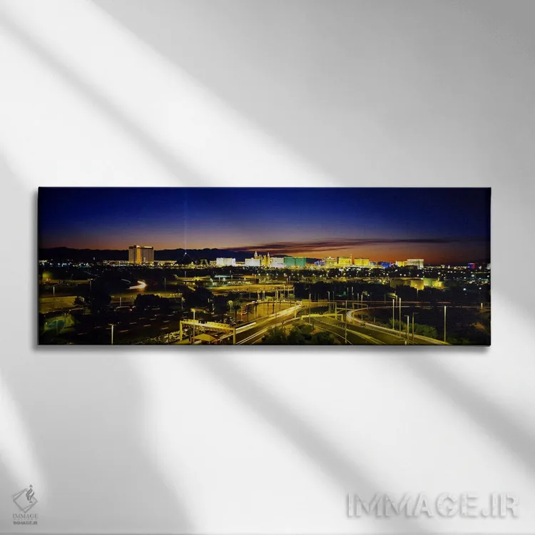 تابلو Las Vegas, Nevada, USA,نمای بالا از ساختمانهای روشن در غروب، لاس وگاس، نوادا، ایالات متحده اثر پانورامیک ایمجز (استودیو عکاسی عریض) - نمای روبهرو روی دیوار