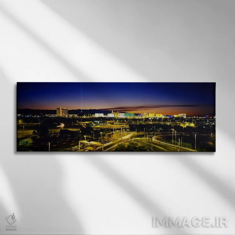 تابلو Las Vegas, Nevada, USA,نمای بالا از ساختمانهای روشن در غروب، لاس وگاس، نوادا، ایالات متحده اثر پانورامیک ایمجز (استودیو عکاسی عریض) - نمای روبهرو روی دیوار