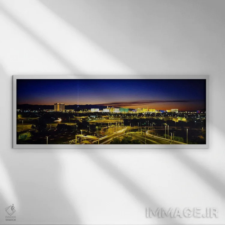 تابلو Las Vegas, Nevada, USA,نمای بالا از ساختمانهای روشن در غروب، لاس وگاس، نوادا، ایالات متحده اثر پانورامیک ایمجز (استودیو عکاسی عریض) - نمای قابدار سفید