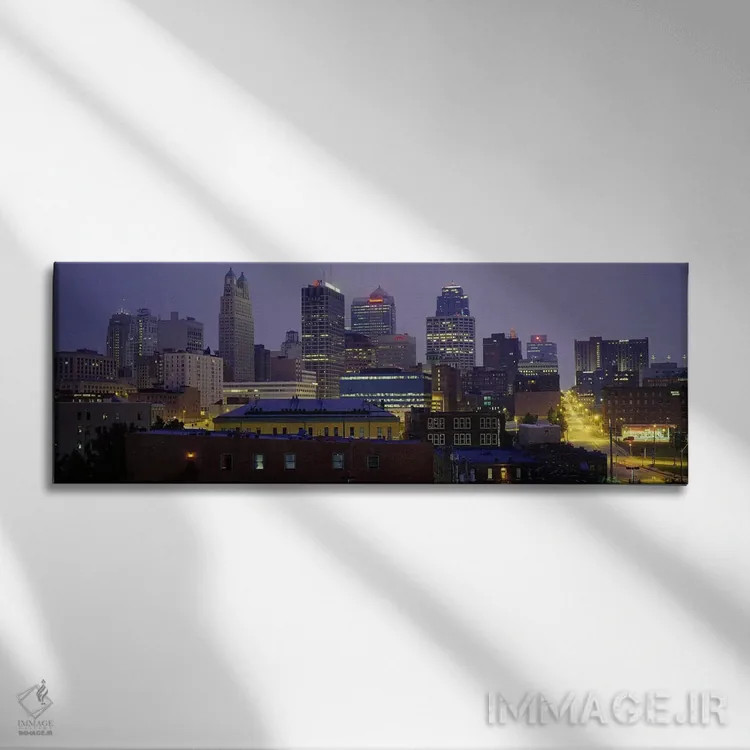 تابلو Missouri, USA,ساختمانهای روشن در غروب، کانزاس سیتی، میزوری، ایالات متحده اثر پانورامیک ایمجز (استودیو عکاسی عریض) - نمای روبهرو روی دیوار